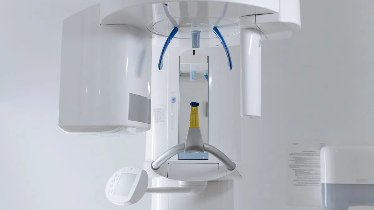 Close-up of modern dental x-ray machine in a clinic setting.
