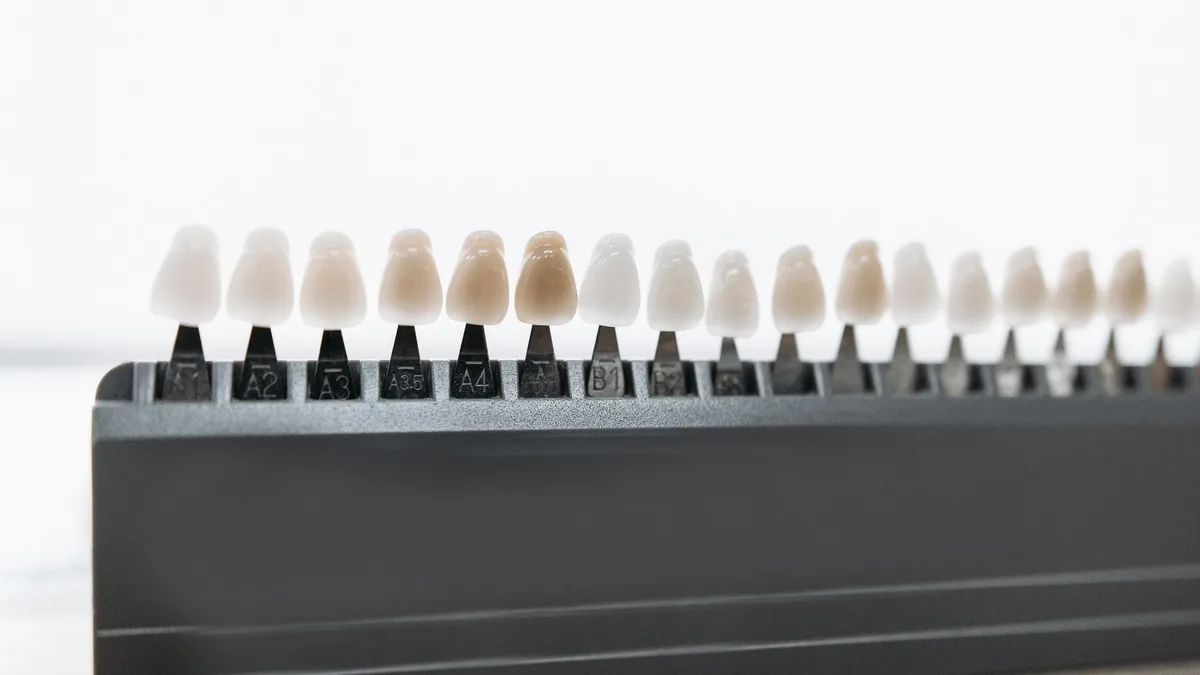 Detailed view of dental veneer shade guide for matching tooth color.