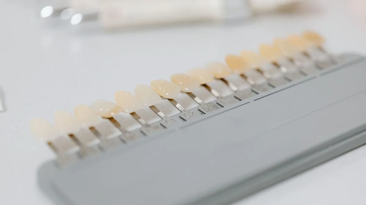 Close-up image of a dental shade guide displaying various tooth color options.