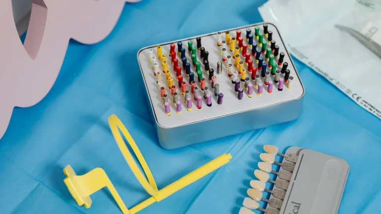 A vibrant collection of dental tools displayed on a sterile blue cloth ready for dental use.